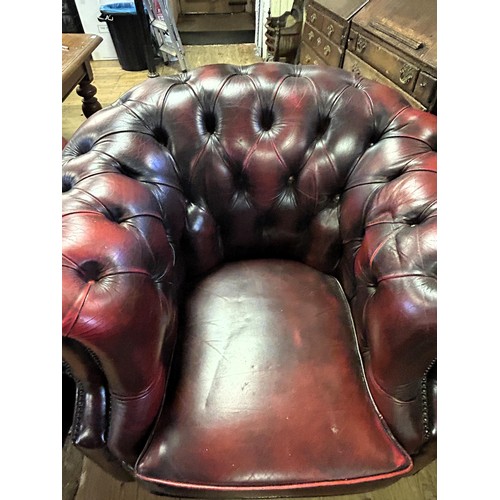 973 - A Chesterfield style red leather armchair