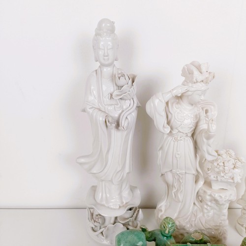 802 - A Chinese Blanc de Chine figure of a goddess, 342 cm high, two other figures and a green glazed figu... 