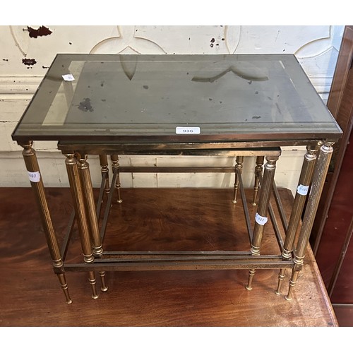 936 - A nest of three brass tables, with glass tops, 53 cm wide