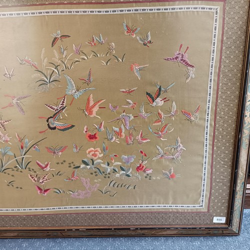 855 - A Chinese silk panel, decorated butterflies, 70 x 120 cm, and two prints (3)