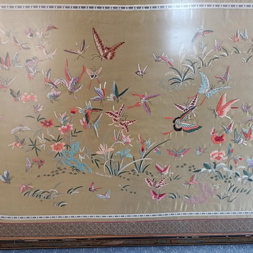 855 - A Chinese silk panel, decorated butterflies, 70 x 120 cm, and two prints (3)