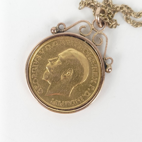 24 - George V Gold Sovereign, 1912, with a yellow metal mount and chain