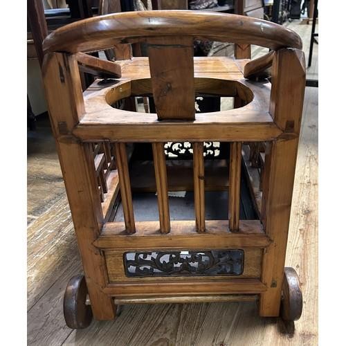 948 - A Chinese hardwood pram, 60 cm wide