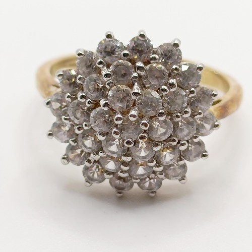 647A - A 9ct gold and white stone cluster ring, ring size S