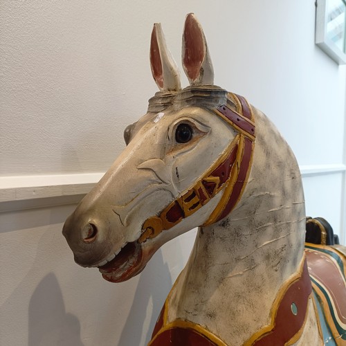 747 - A painted wood carousel style galloping horse, 127 cm high