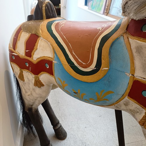 747 - A painted wood carousel style galloping horse, 127 cm high