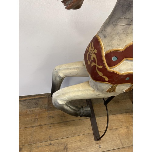 747 - A painted wood carousel style galloping horse, 127 cm high