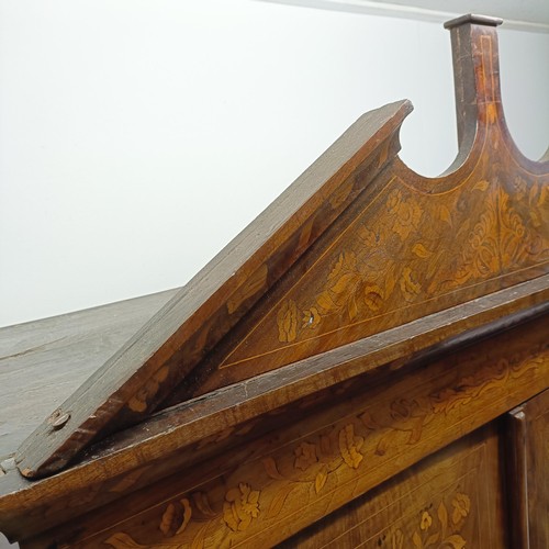 685 - A 19th century Dutch mahogany linen press, with floral marquetry decoration, the two cupboard doors ... 