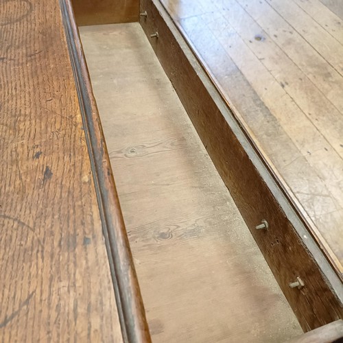 699 - A 19th century oak lowboy, having four drawers, on cabriole legs, 89 cm wide