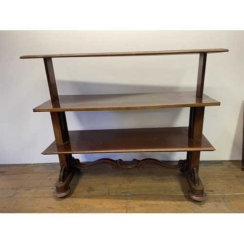 697 - A mahogany three tier rise and fall buffet, 140 cm wide