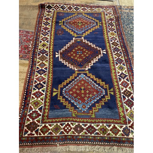 732 - A Kazak rug, 232 x 143 cm