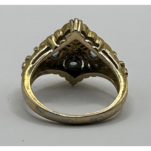 125 - A silver gilt  aquamarine and diamond cluster ring