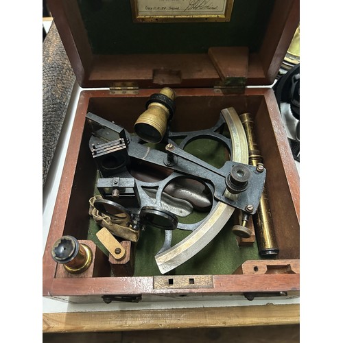 509 - A 19th century brass adjustable telescope, 52 cm wide, and a Husun sextant, in a mahogany case (2)