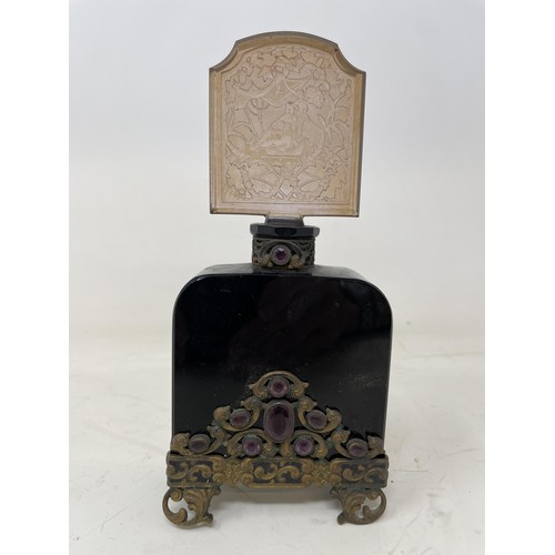 387 - An Art Nouveau engraved glass perfume bottle, with gilt metal mounts, 18 cm high