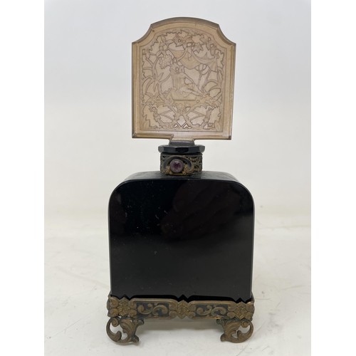 387 - An Art Nouveau engraved glass perfume bottle, with gilt metal mounts, 18 cm high