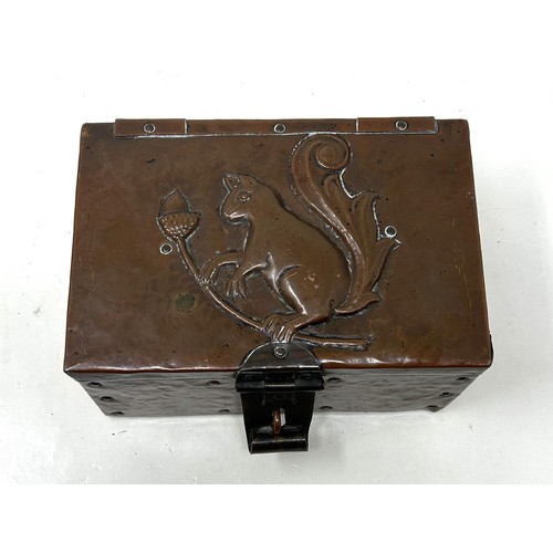 386 - A John Pearson copper box, decorated a squirrel and acorns, monogrammed J P, 17 cm wide