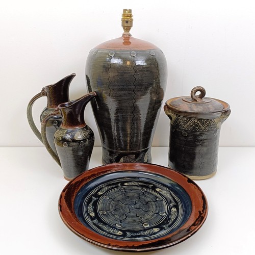 An Art Pottery lamp base, decorated fish, a matching storage jar, a