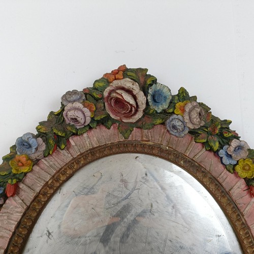 376 - An Art Deco Barbola style oval strut mirror, decorated flowers, 57 x 47 cm