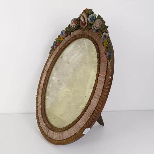 376 - An Art Deco Barbola style oval strut mirror, decorated flowers, 57 x 47 cm