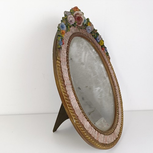 376 - An Art Deco Barbola style oval strut mirror, decorated flowers, 57 x 47 cm