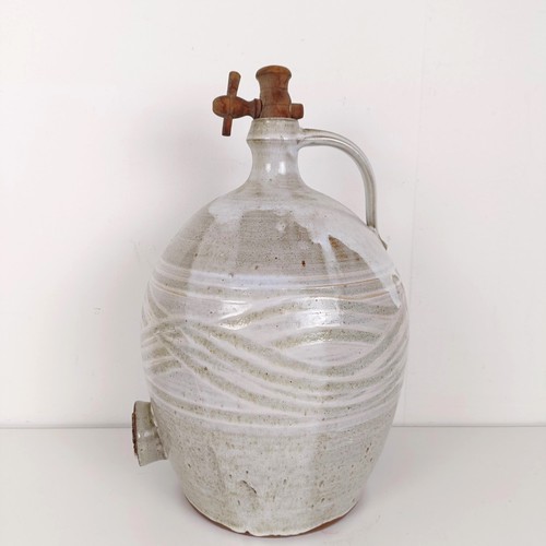 377 - A white glazed cider jug, 40 cm high