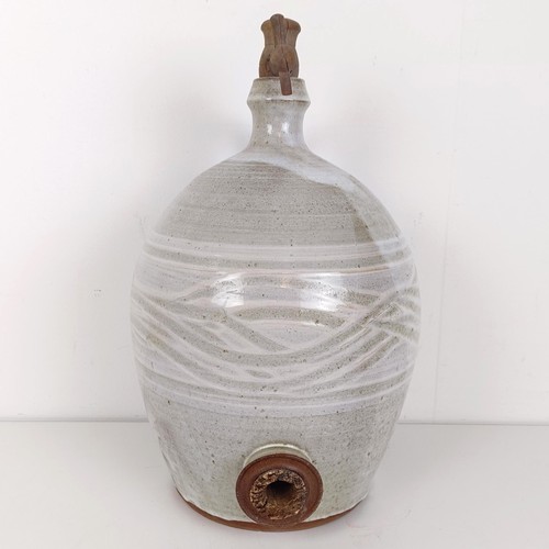 377 - A white glazed cider jug, 40 cm high