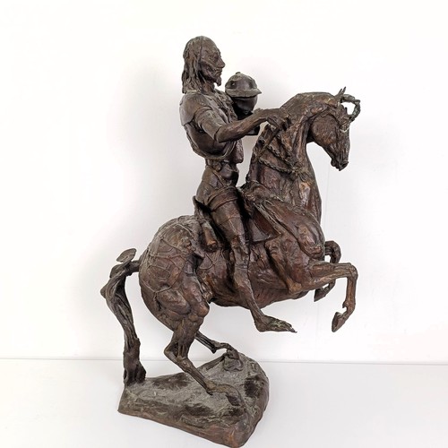 381 - A 20th century bronze group, of a horse and rider, 50 cm high