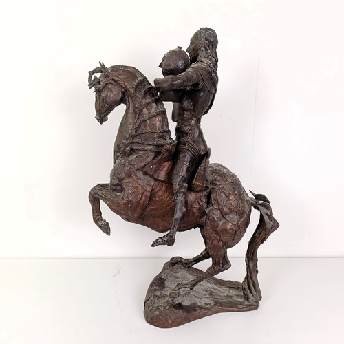 381 - A 20th century bronze group, of a horse and rider, 50 cm high