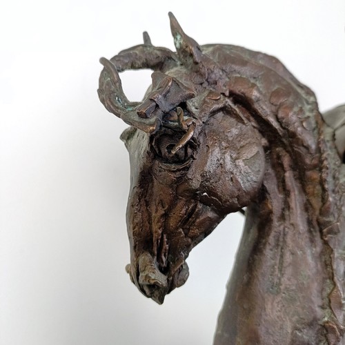 381 - A 20th century bronze group, of a horse and rider, 50 cm high