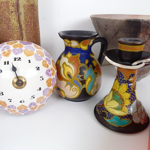 382 - A stoneware bottle vase, 33 cm high, a novelty clock, an Art Pottery bowl, a set of six engraved gla... 