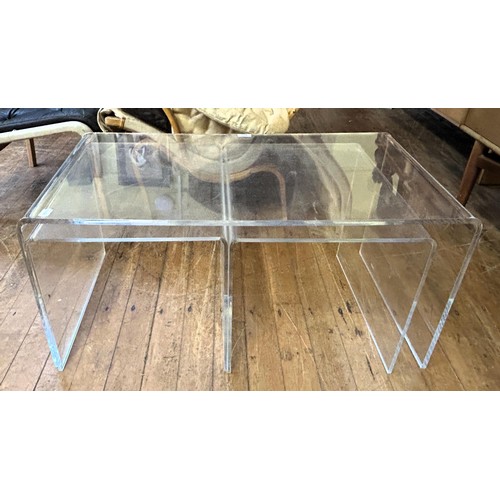 433 - A nest of three clear plastic tables, 90 cm wide