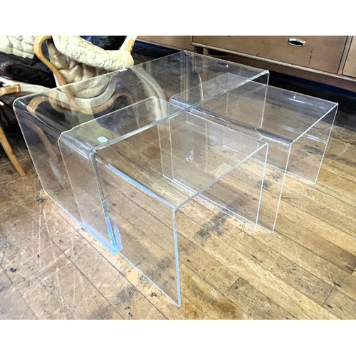 433 - A nest of three clear plastic tables, 90 cm wide