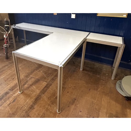 426 - An Italian Ciancimino stainless steel and laminate three section table