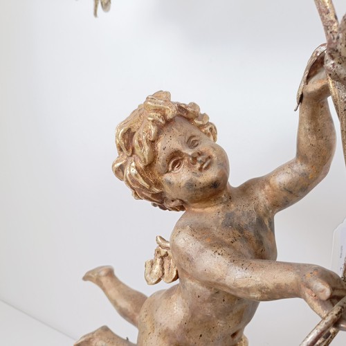 506 - A pair of giltwood and metal lamps, in the form of cherubs, 80 cm high (2)