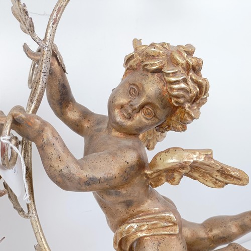 506 - A pair of giltwood and metal lamps, in the form of cherubs, 80 cm high (2)