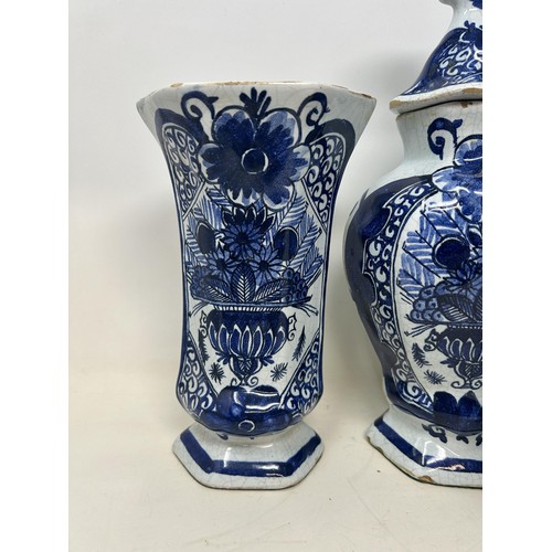 517 - A Delft garniture, comprising three vases and covers, 34 cm high, and a pair of vases, 20 cm high (5... 