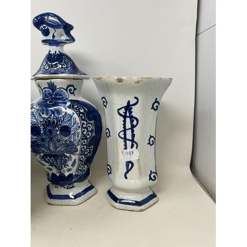 517 - A Delft garniture, comprising three vases and covers, 34 cm high, and a pair of vases, 20 cm high (5... 