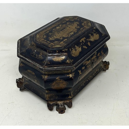 518 - A 19th century lacquered tea caddy, with two canisters, 22 cm wide