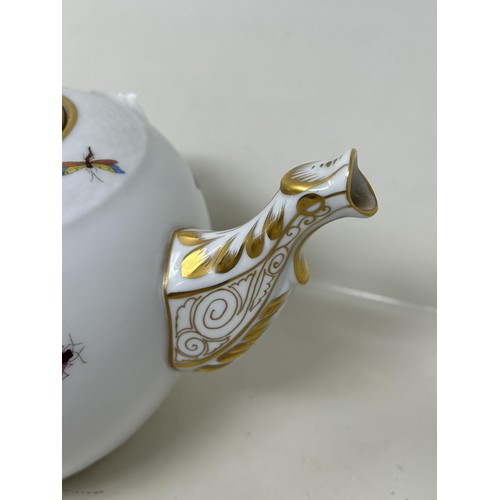 592 - An Herend porcelain tea pot, decorated birds, 17 cm high