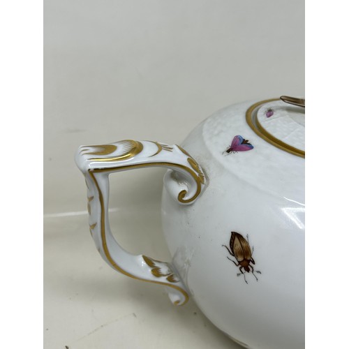 592 - An Herend porcelain tea pot, decorated birds, 17 cm high