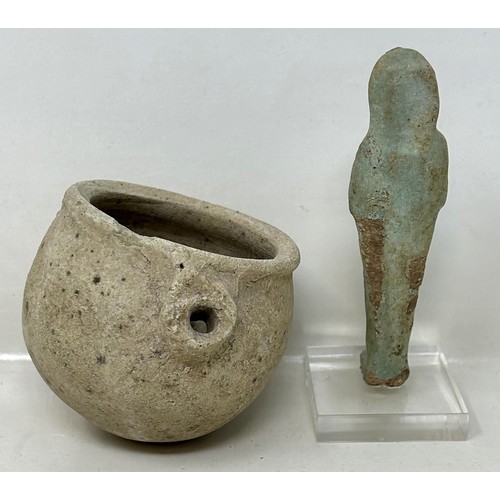 593 - An Egyptian Ushabti style figure, 10 cm high, and a Roman style stoneware pot (2)