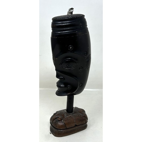 594 - A carved horn bust, on a carved wooden base, possibly Australasian, 18 cm high