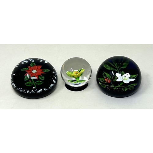 602 - A William Manson glass paperweight, and two others (3)