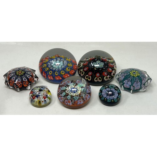 606 - A Vasart glass paperweight, a Strathern glass paperweight, and five others (7)