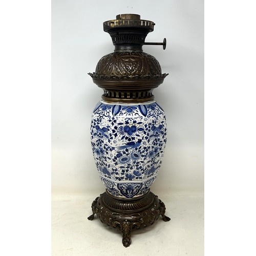 537 - A Delft oil lamp, 46 cm high