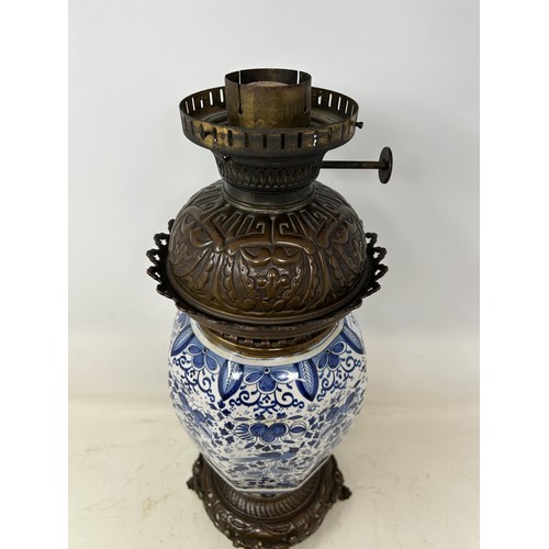 537 - A Delft oil lamp, 46 cm high