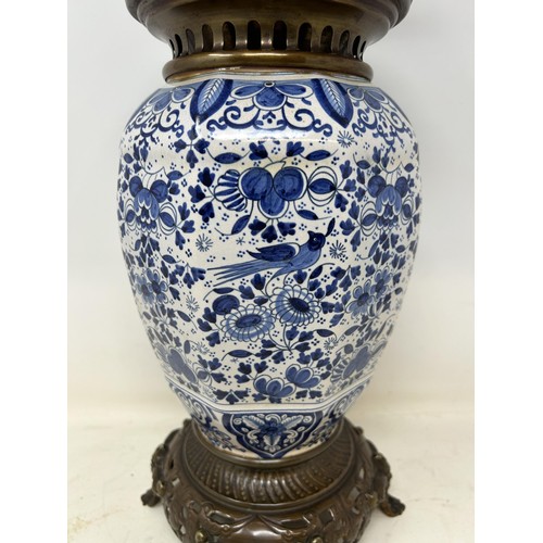 537 - A Delft oil lamp, 46 cm high