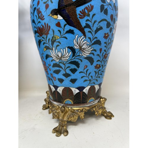 541 - A pair of cloisonné vases, decorated flowers and birds, and with gilt metal mounts, 24 cm high (2)