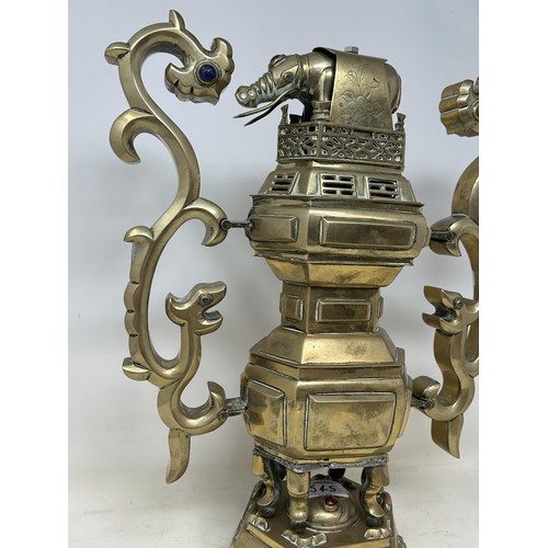 545 - A Chinese brass censer, with an elephant finial, 48 cm high