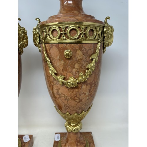 527 - A pair of French style pink onyx cassolettes, with gilt metal mounts, 56 cm high (2)